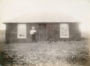 Southwest Custer CountySolomon D. Butcher, Nebraska 1892 (sod house, man, dog), black & white photograph