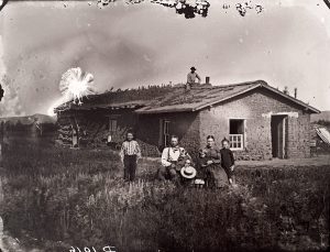 Solomon D. Butcher, "The Power of Suggestion," Theodore Hohman family (altered), black & white photograph (from glass plate negative in the Nebraska State Historical Society Collection)