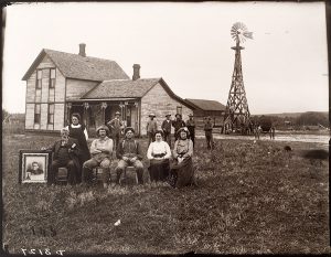 Solomon D. Butcher, Jack Bush, Sr., and his family at their house near Sumner, Dawson County, Nebraska, 1903, black & white photograph (from glass plate negative in the Nebraska State Historical Society Collection) c. 1982-1984