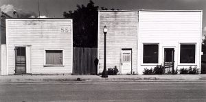 Wright Morris, Stores with False Fronts, Western Kansas, 1943, silver print, 1975