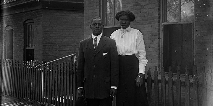 John Johnson, Untitled (couple un front of home), black & white photograph (from glass plate negative in the MONA Archives Collection), 2018, 14 × 11"